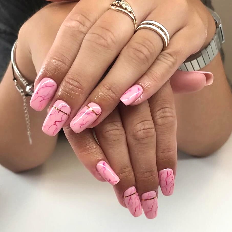 
pink marble with golden stripe hybrid manicure